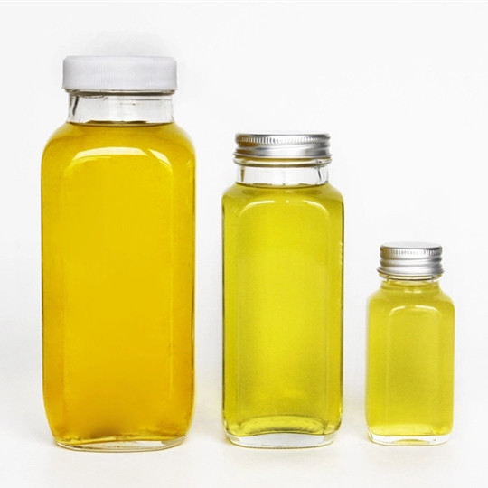 1593254360896317.jpg glass juice bottles with lids.jpg