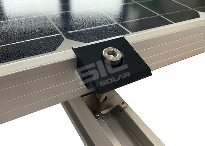 Solar panel grounding washers under mid clamps Solar panel grounding washers under mid clamps